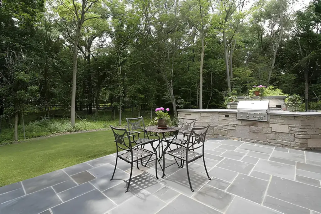 Custom Stone Outdoor Kitchen and Entertainment Area
