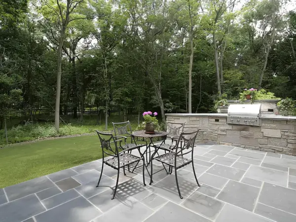 Custom Stone Outdoor Kitchen and Entertainment Area